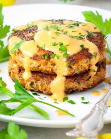 Easy Low Carb Salmon Patties on a plate with aioli sauce.