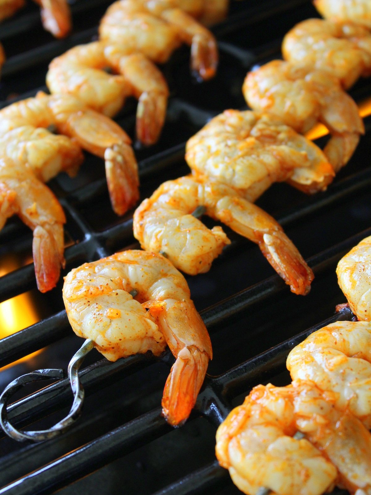 A close-up photo of shrimp on the grill.