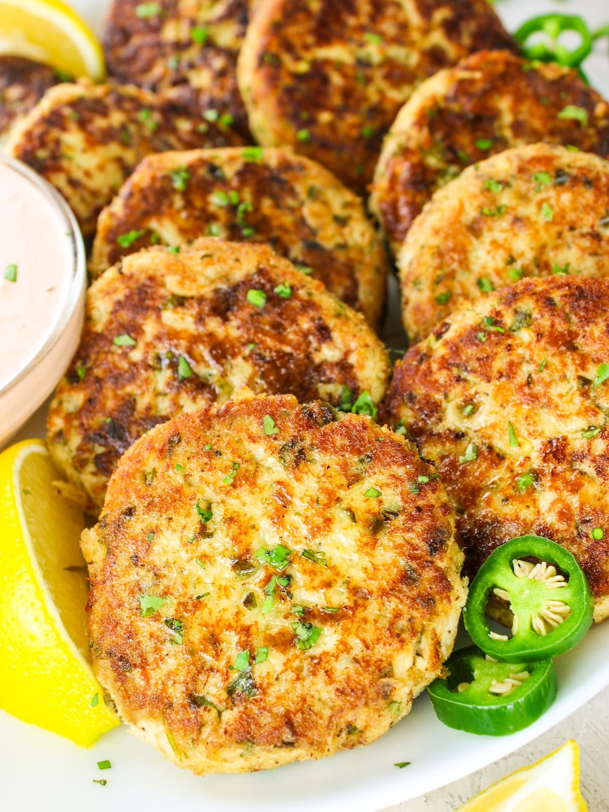 A close-up photo of tuna cakes on a plate.