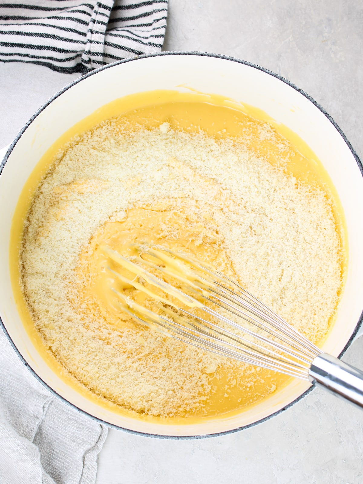 Parmesan cheese added to the roux.