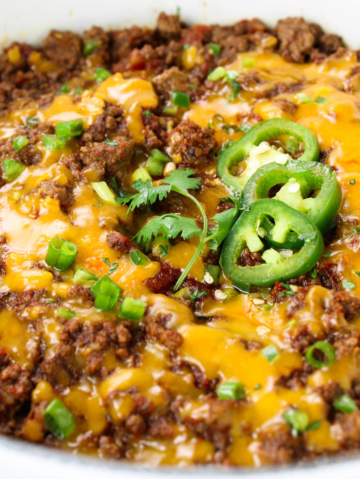 Close-up photo of chili with cheese melted on top.