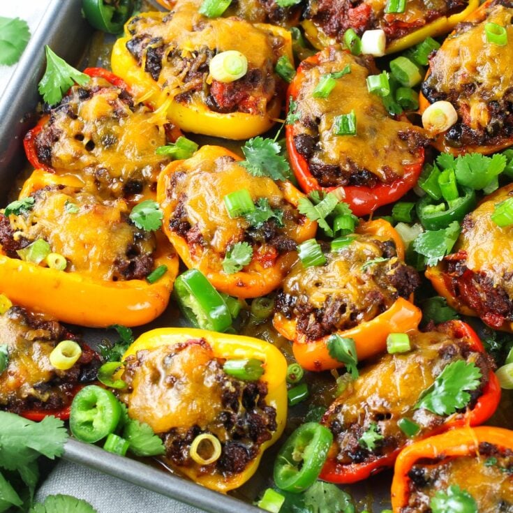 Low Carb Nachos - Mexican Stuffed Peppers cooked on a baking sheet.
