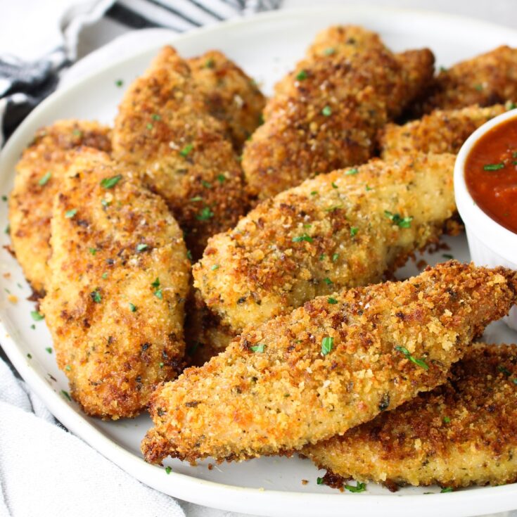 Parmesan Baked Chicken Strips on a plate.