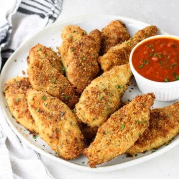 Parmesan Baked Chicken Strips on a plate.