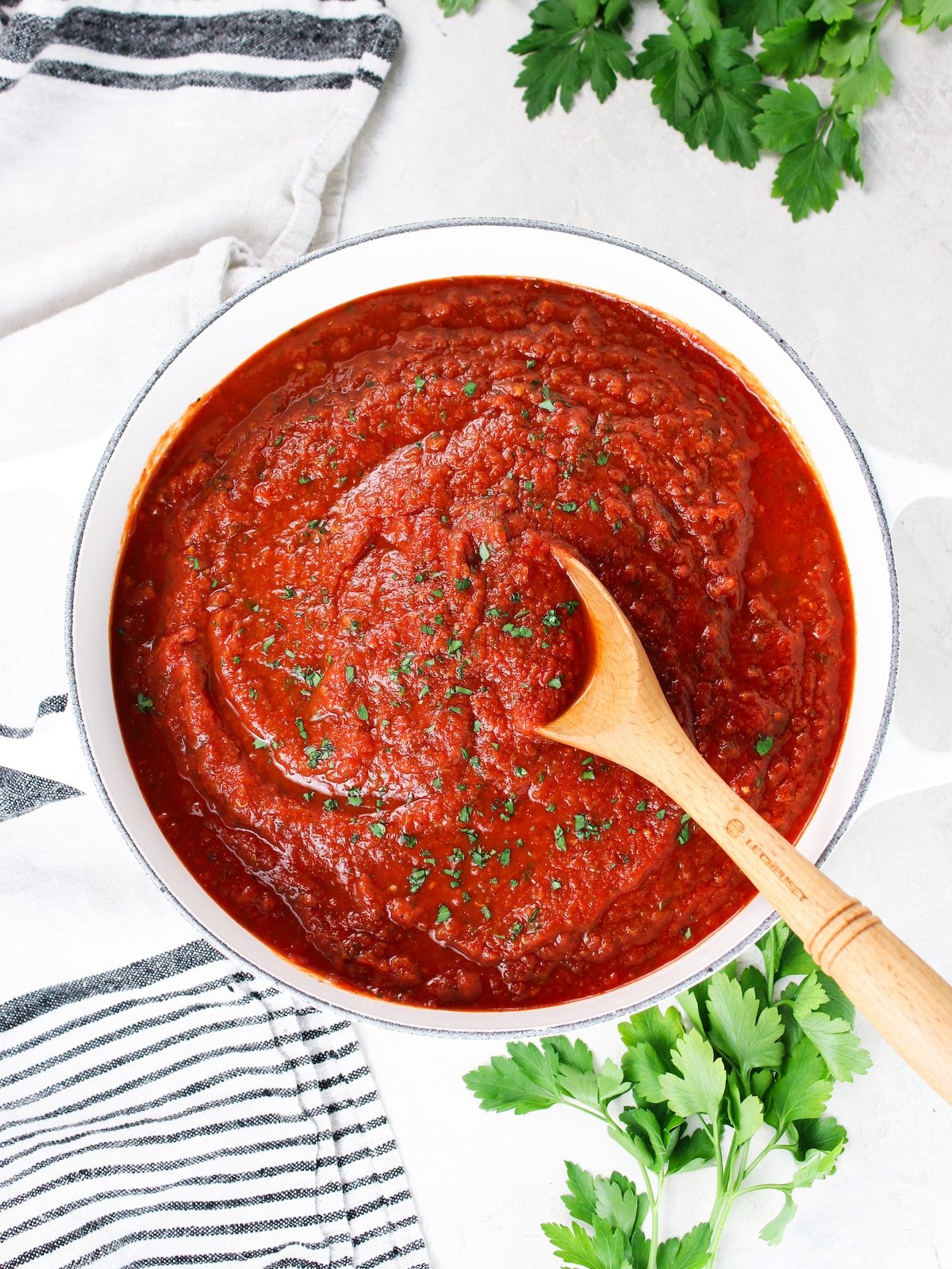 A wide photo of a pot of pasta sauce - marinara.