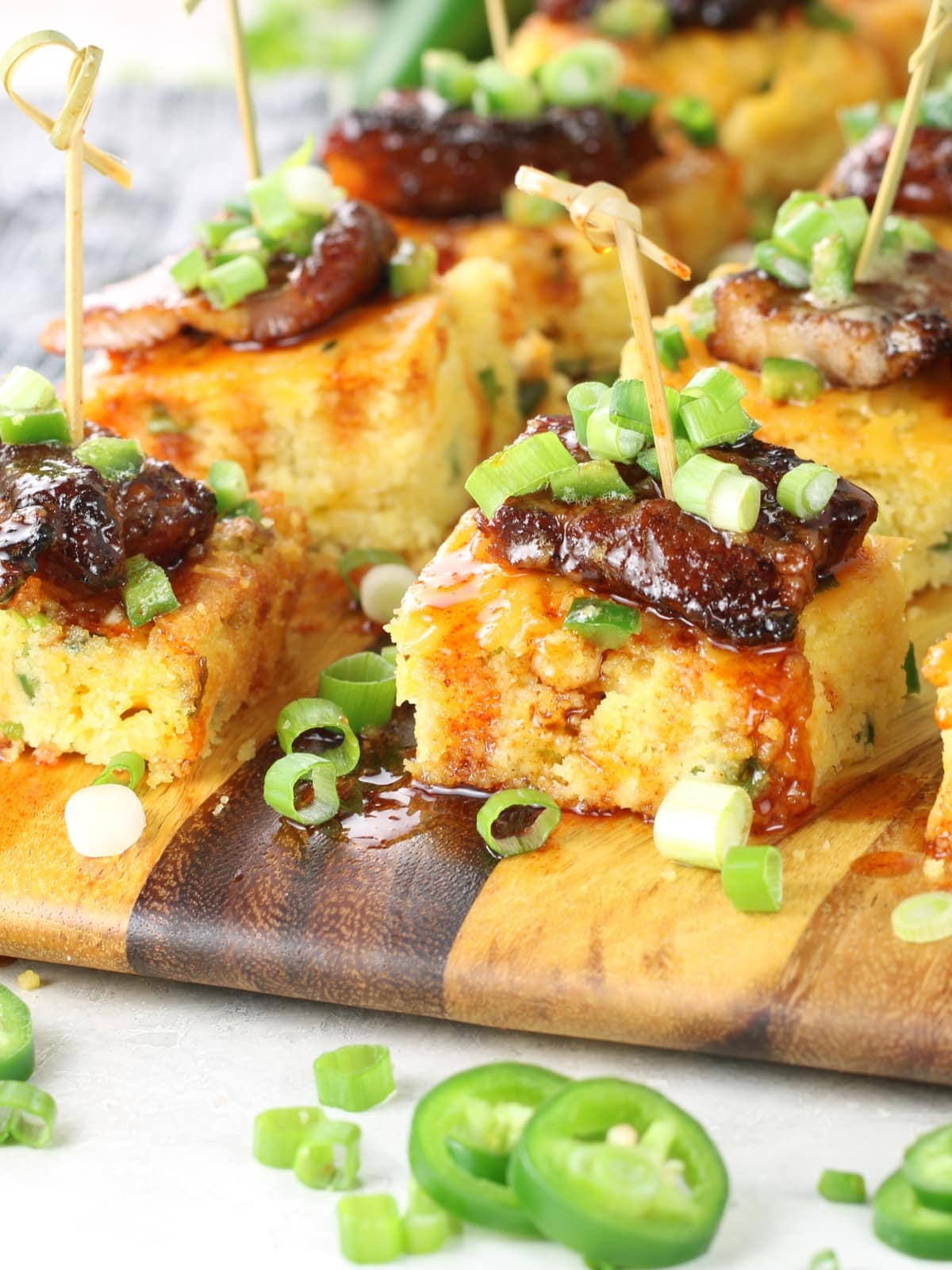 Delicious Crispy Pork Belly with Jalapeño Cheddar Cornbread and Hot Honey.