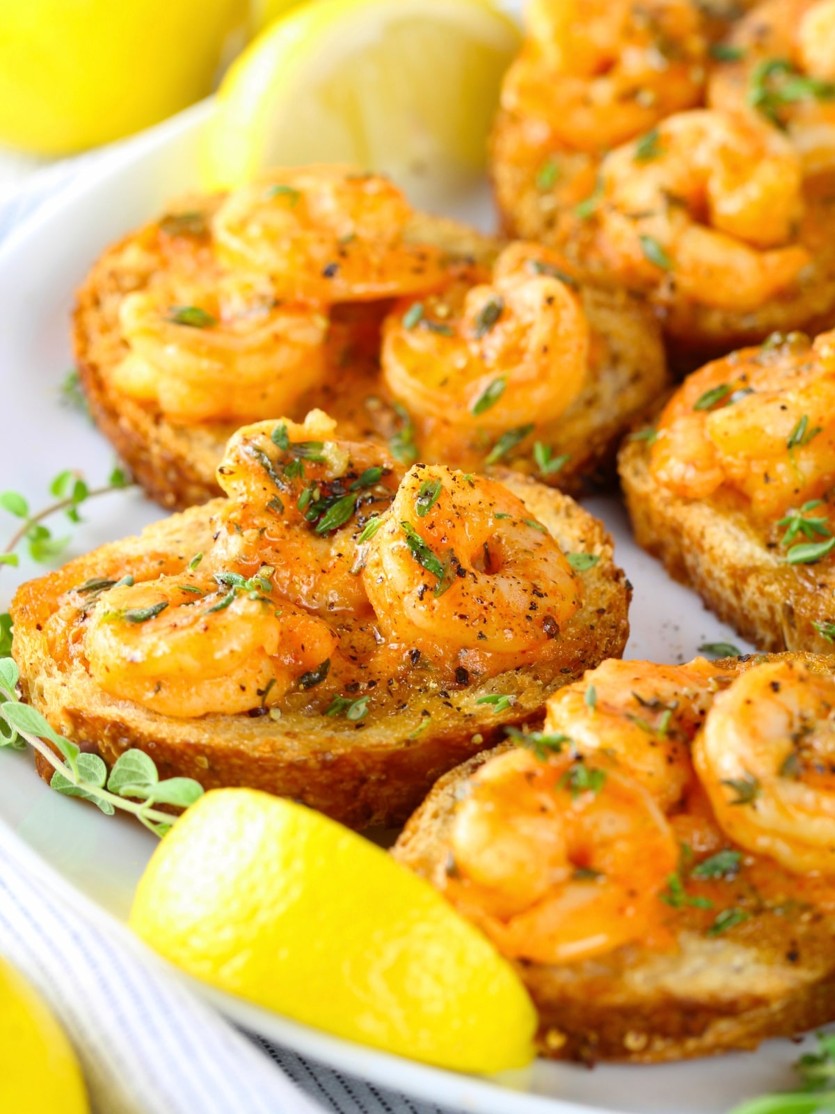 Easy appetizers - Easy Cajun Shrimp Toast Appetizers with lemon wedges on a platter.