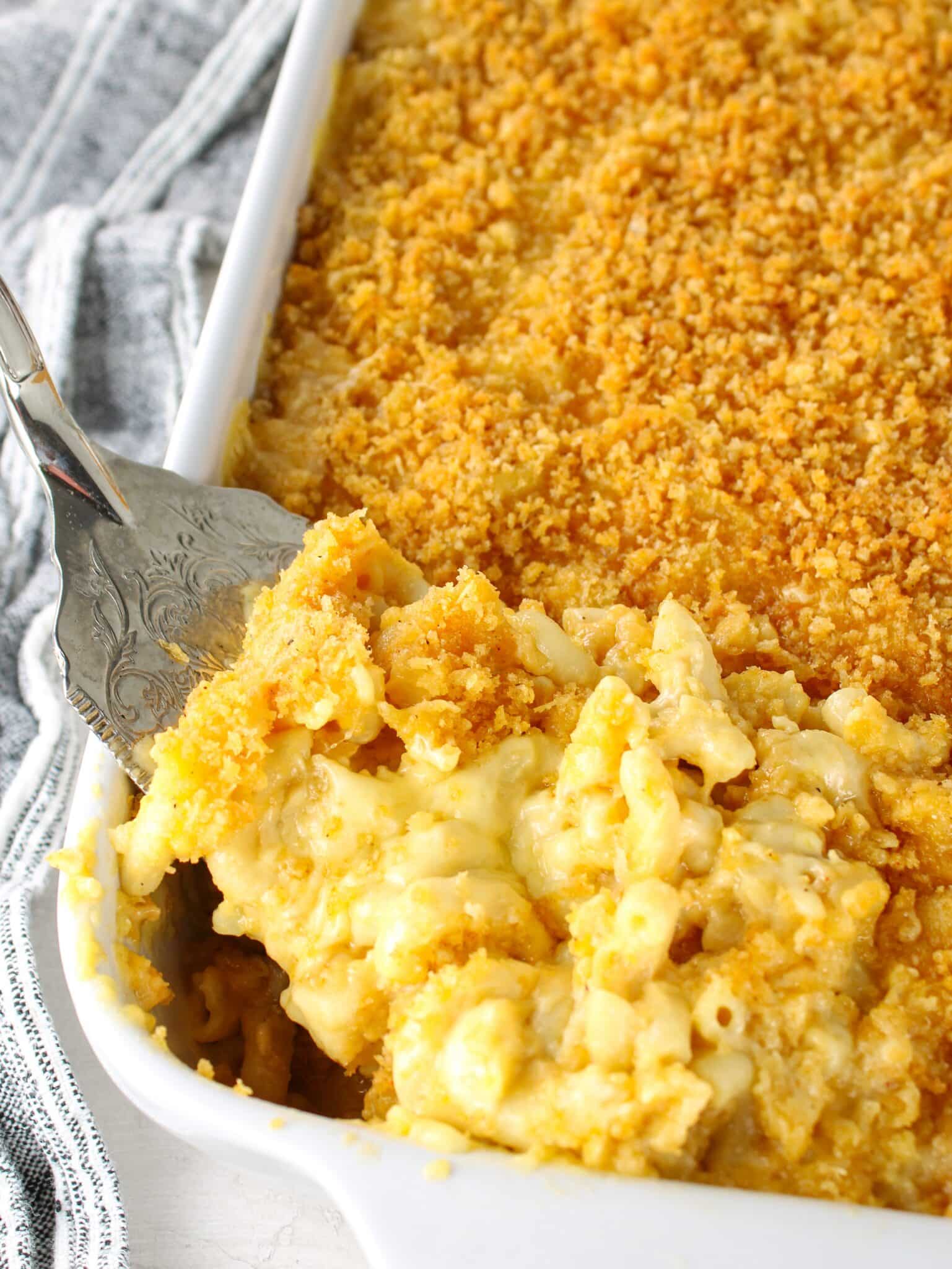 A 9x13 baking dish with baked macaroni and cheese.