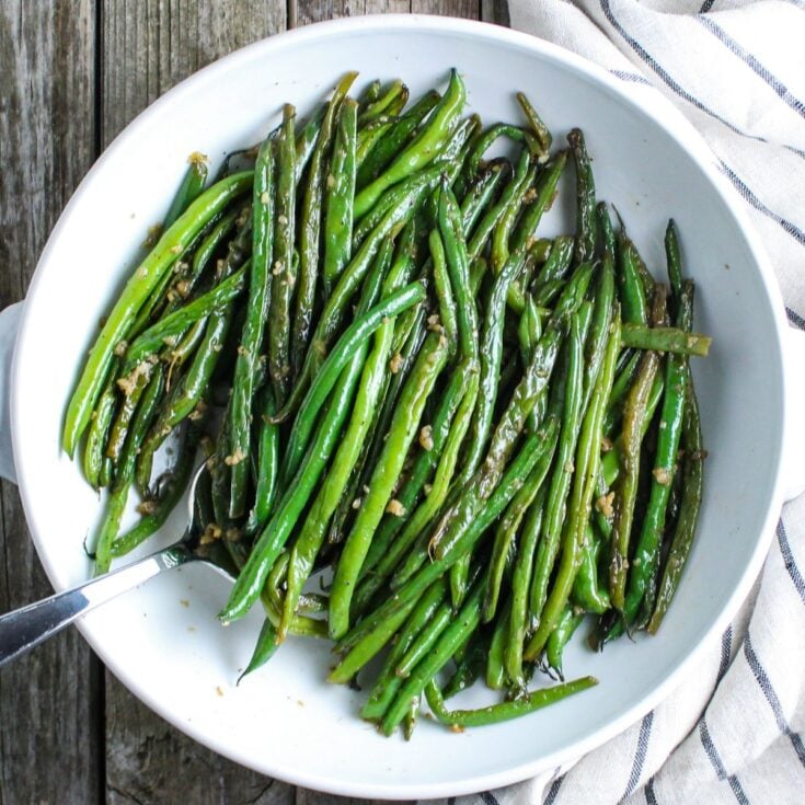 1200x1200 photo of Easy Garlic Green Beans in a bowl.