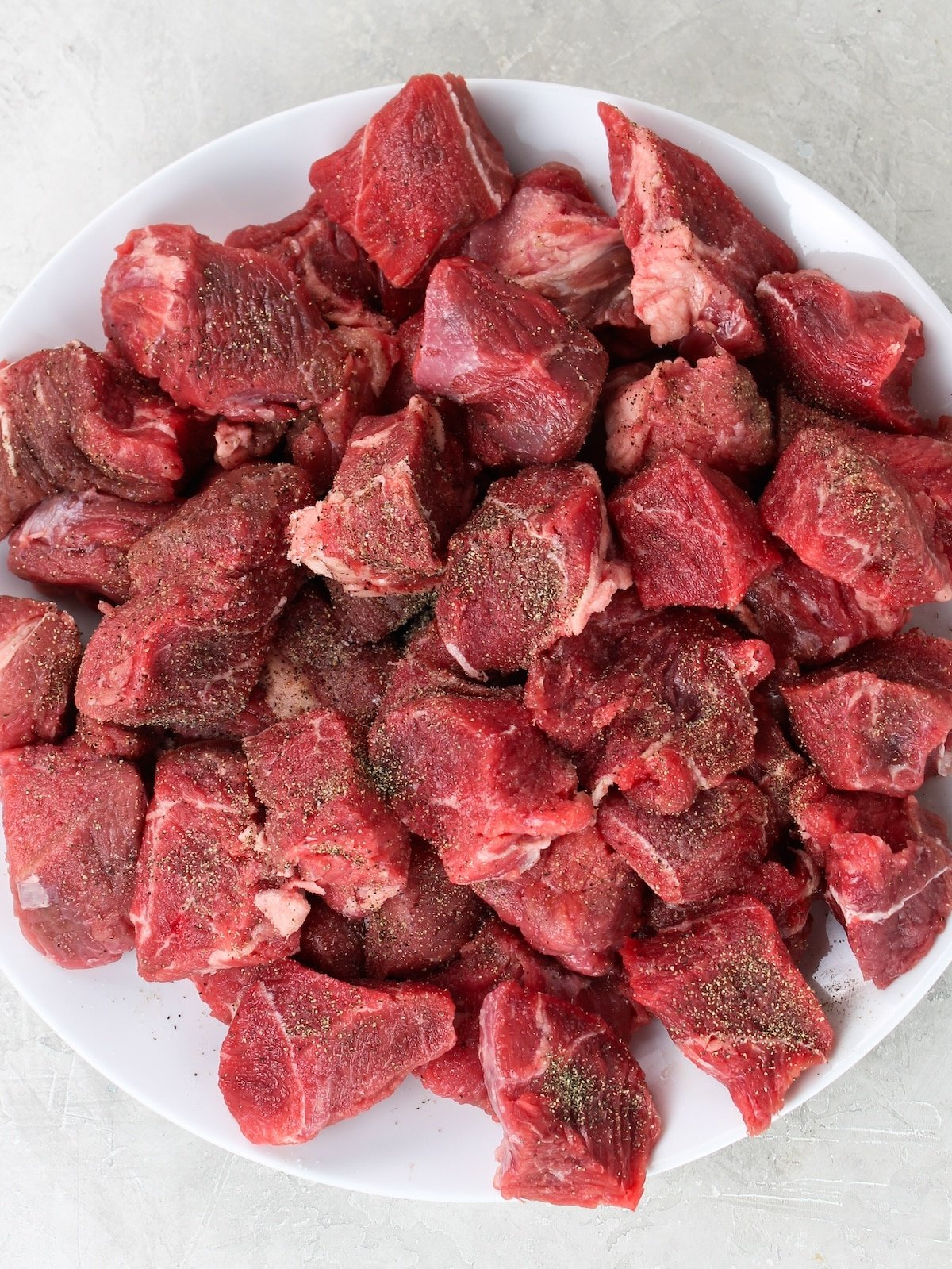 A beef chuck roast that's cut up into cubes.