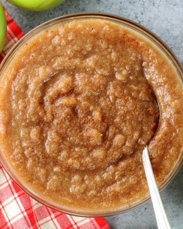 A bowl of Instant Pot applesauce with cinnamon sprinkled on it.
