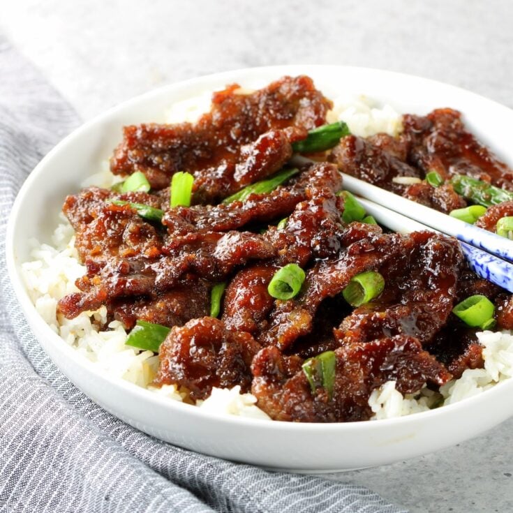 30-Minute Mongolian Beef in a bowl over rice.