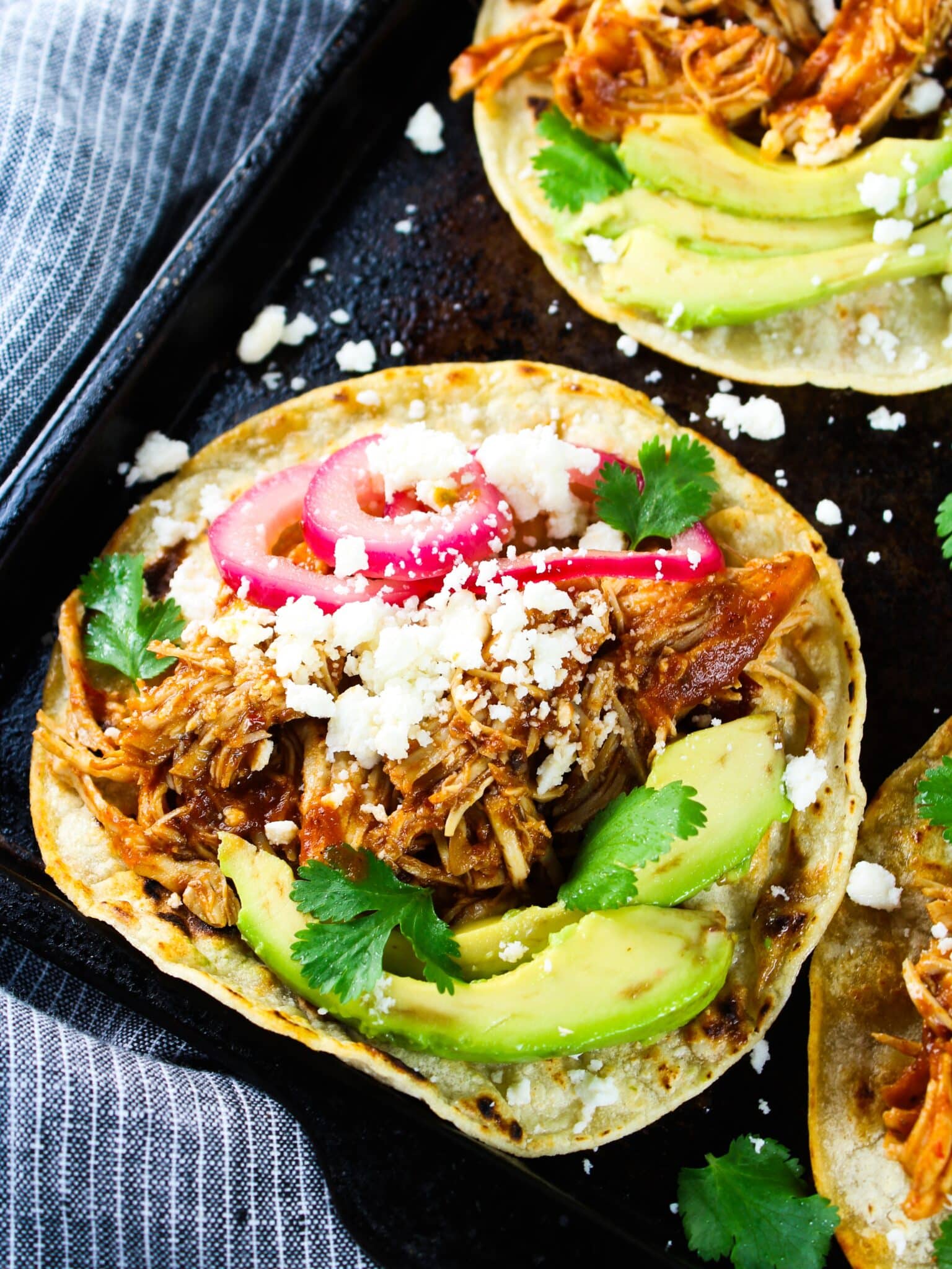 A baking sheet with a few tacos made from this recipe.