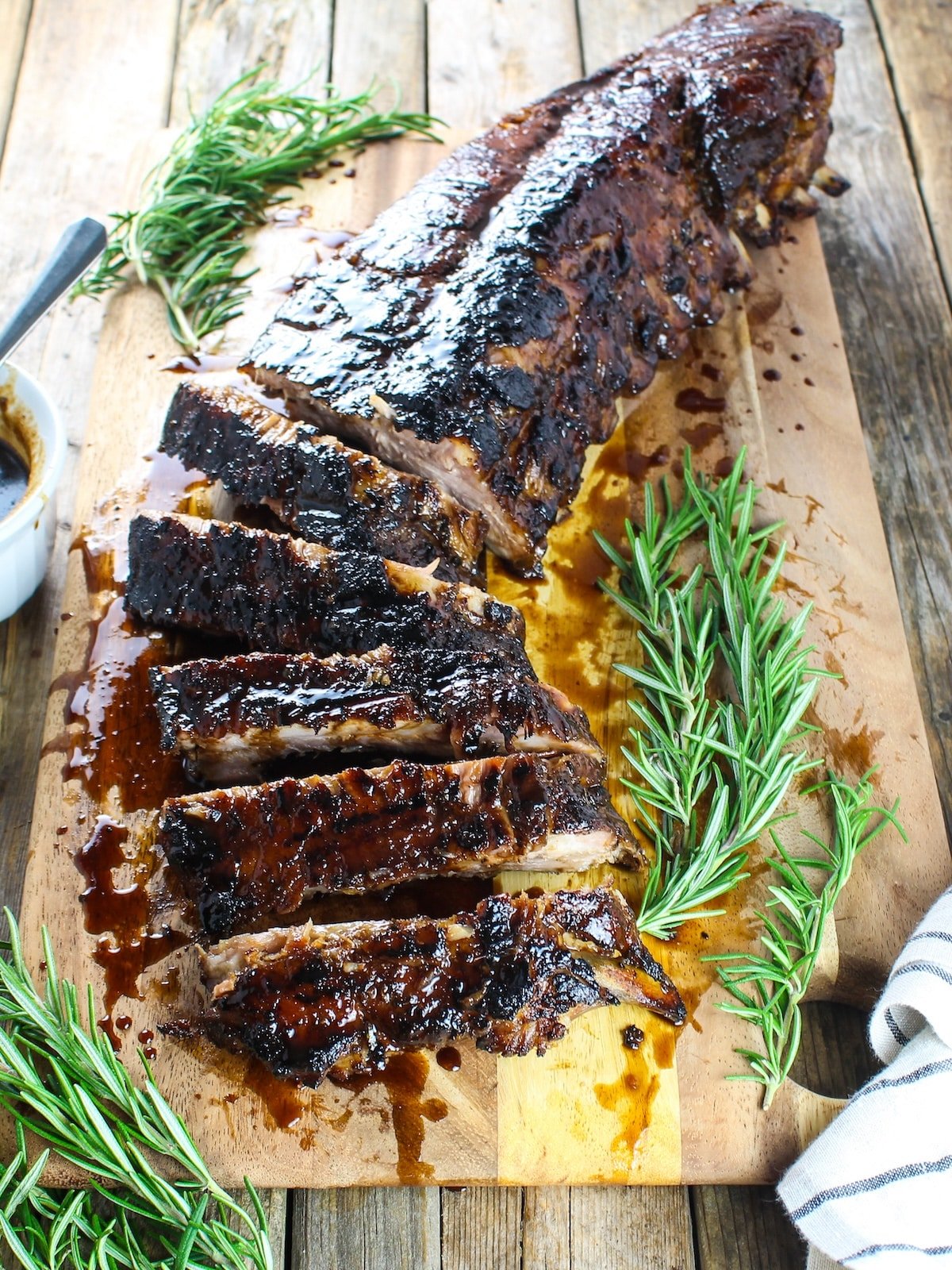 Balsamic Baby Back Ribs on a cutting board - a tasty cookout menu recipe.