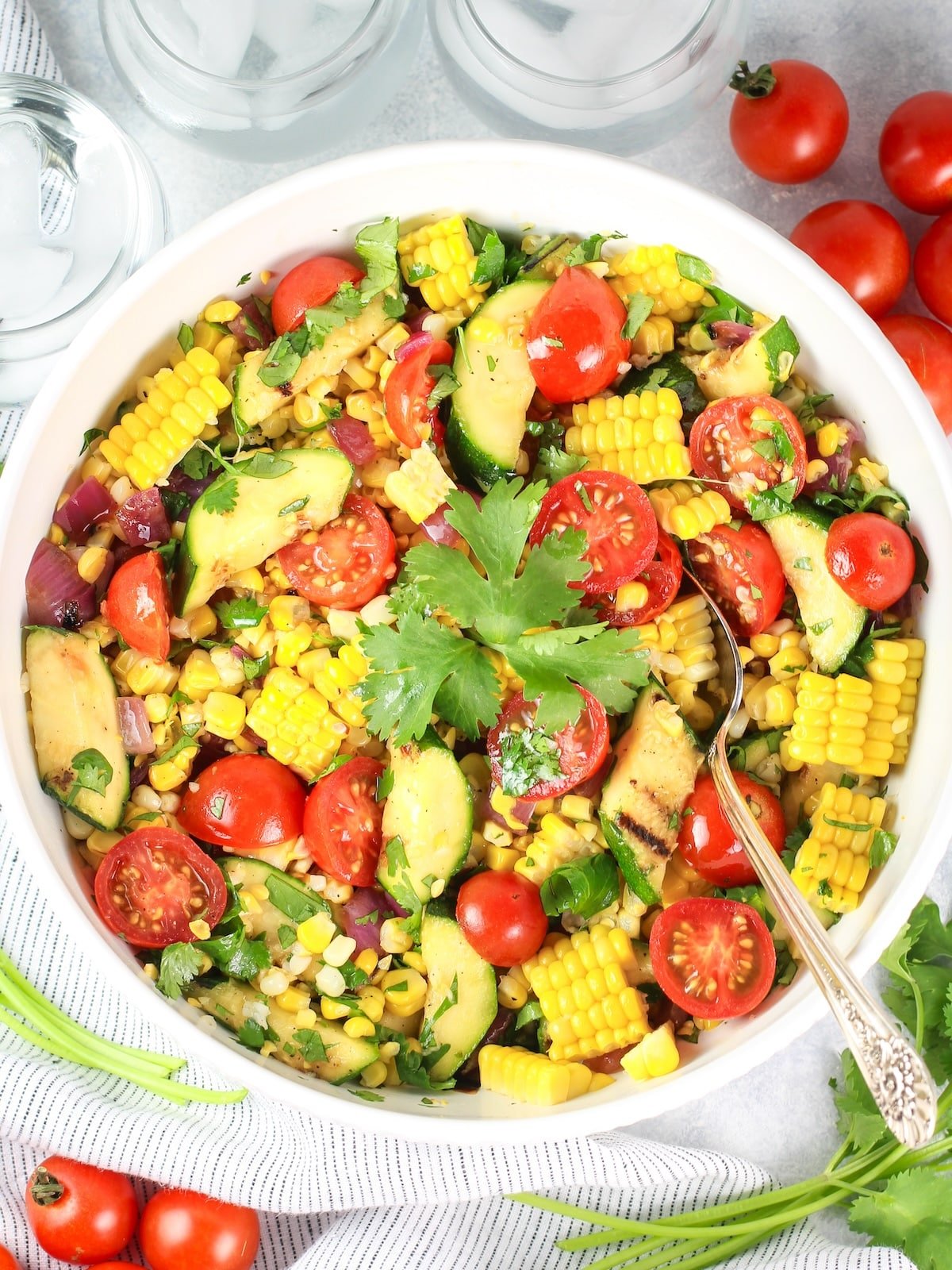 A bowl full of Grilled Veggie Corn Salad - a delicious cookout menu recipe.