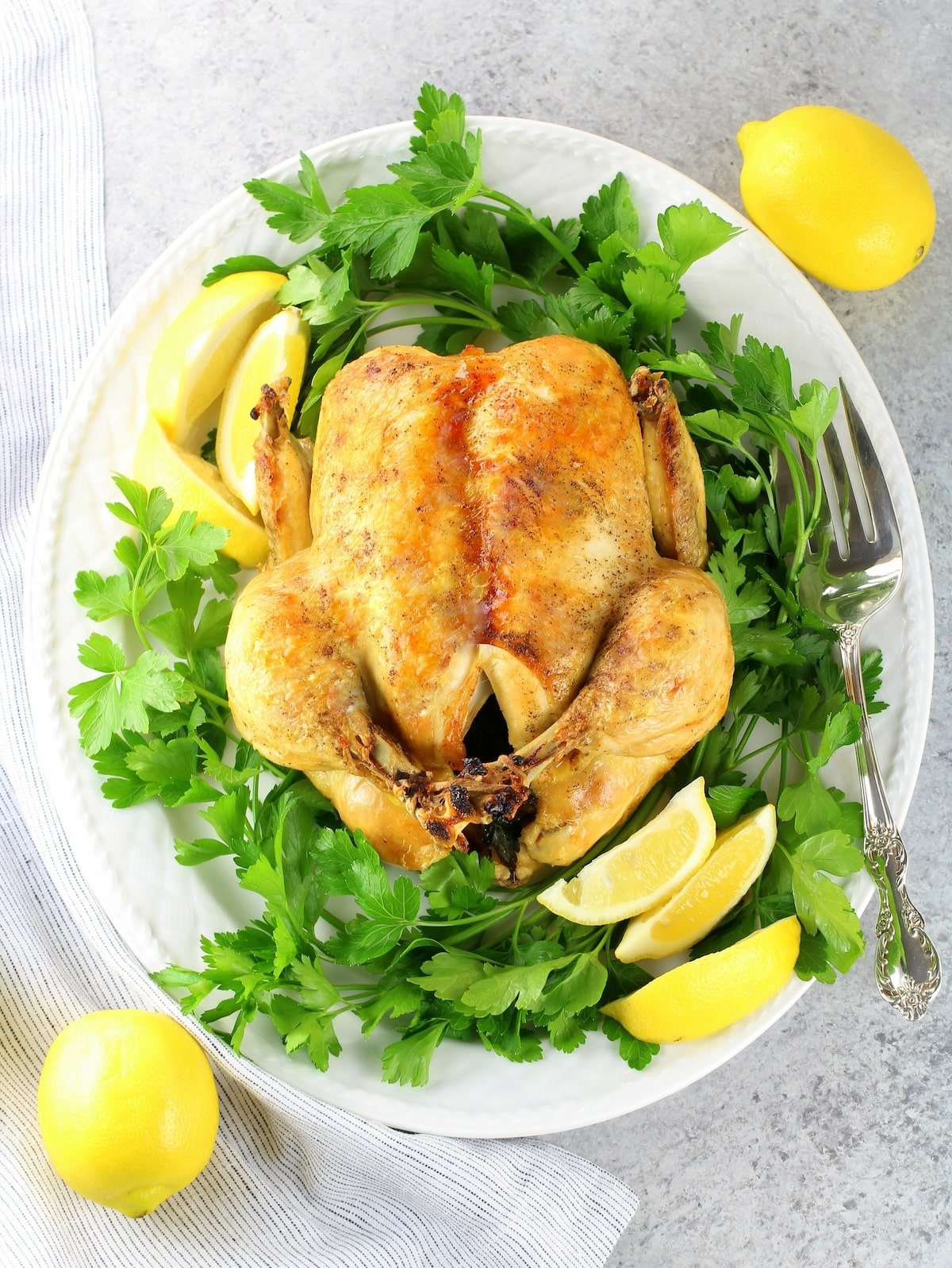 A cooked Instant Pot Whole Chicken on a platter.