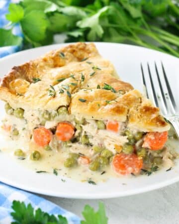 A 1200x1200 square photo of a piece of the baked chicken pot pie recipe on a plate.