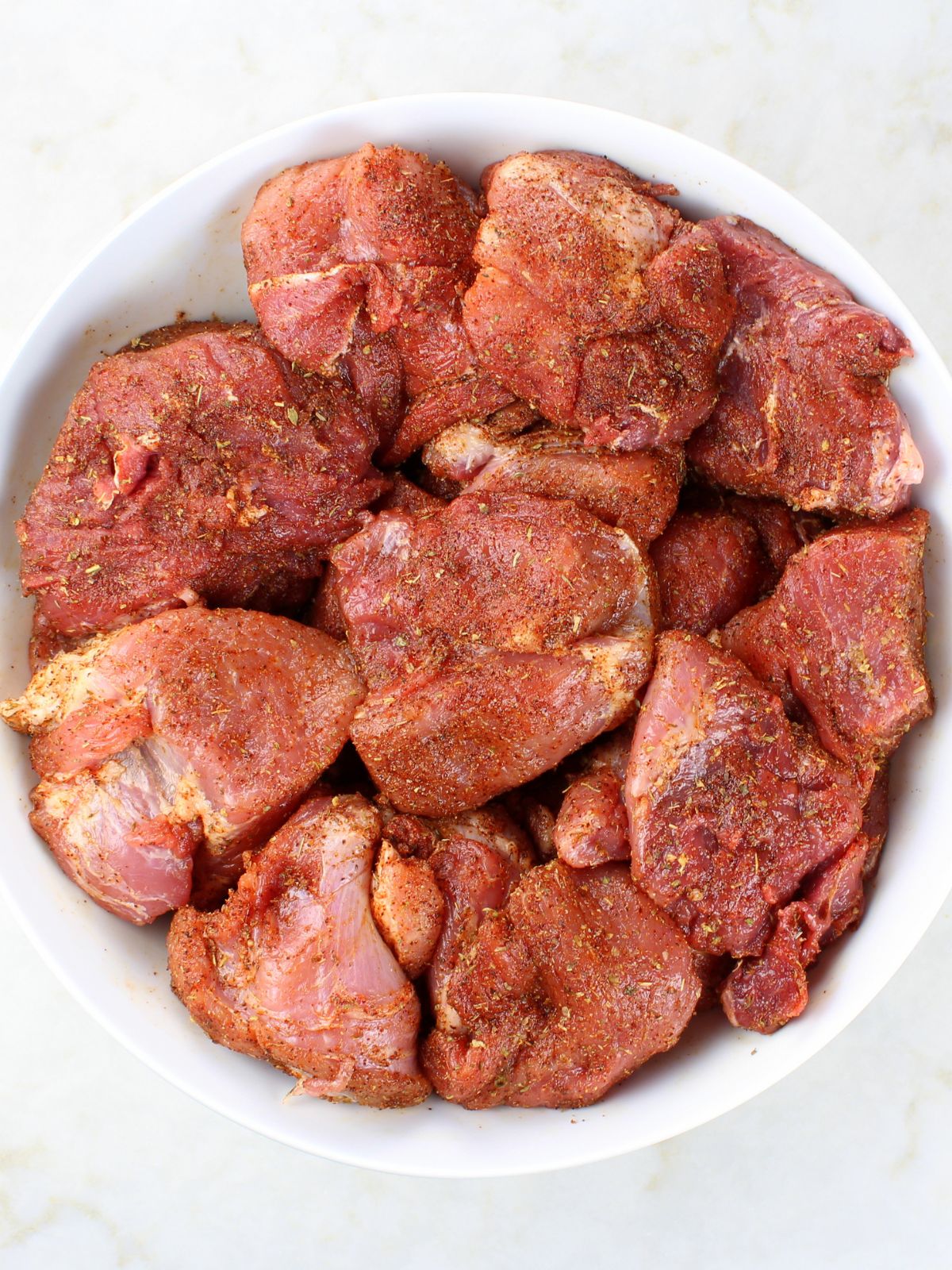 How to make pork carnitas - seasoned pork carnitas meat before it's cooked.