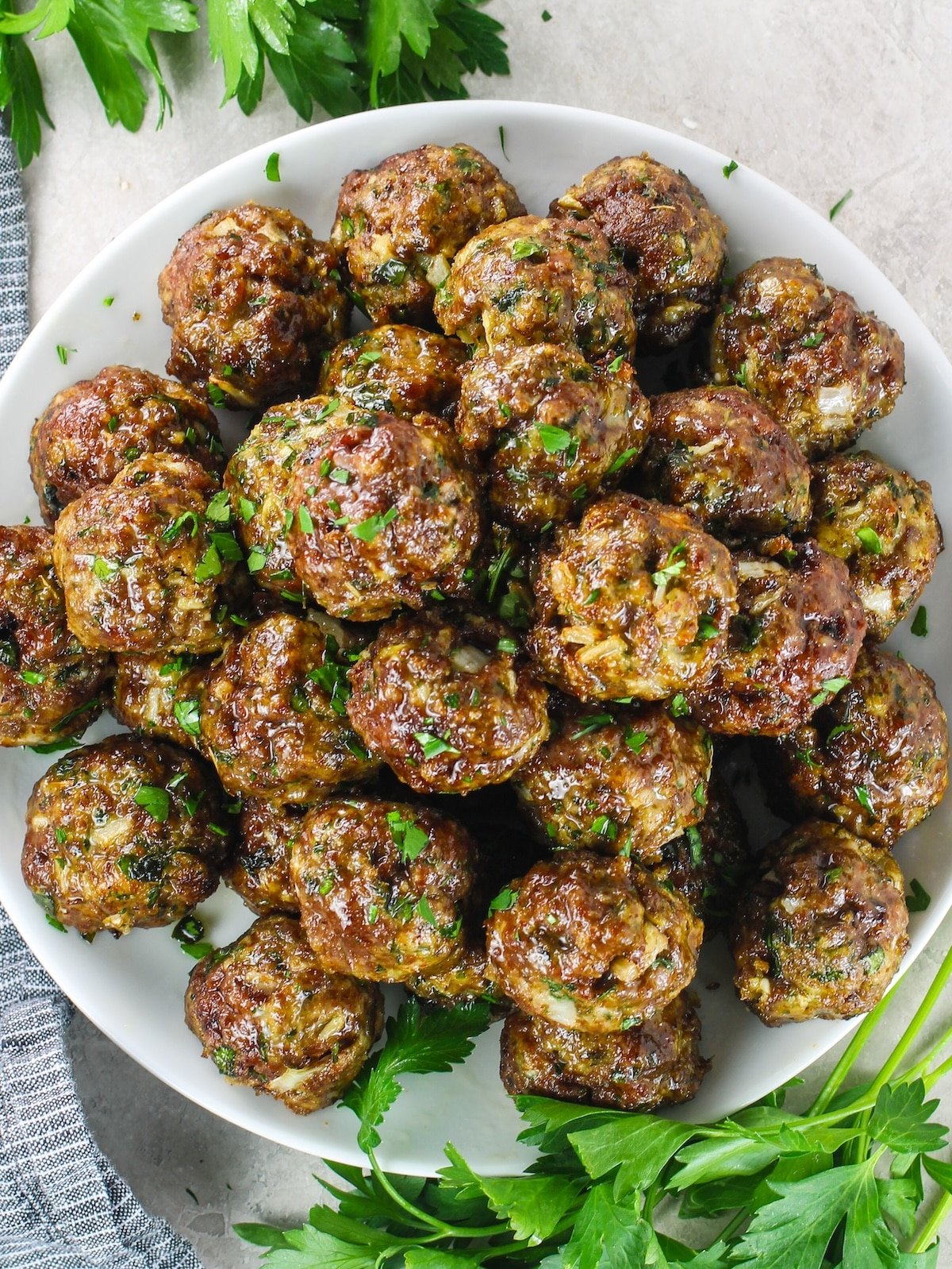 A platter with a pyramid of Italian meatballs.