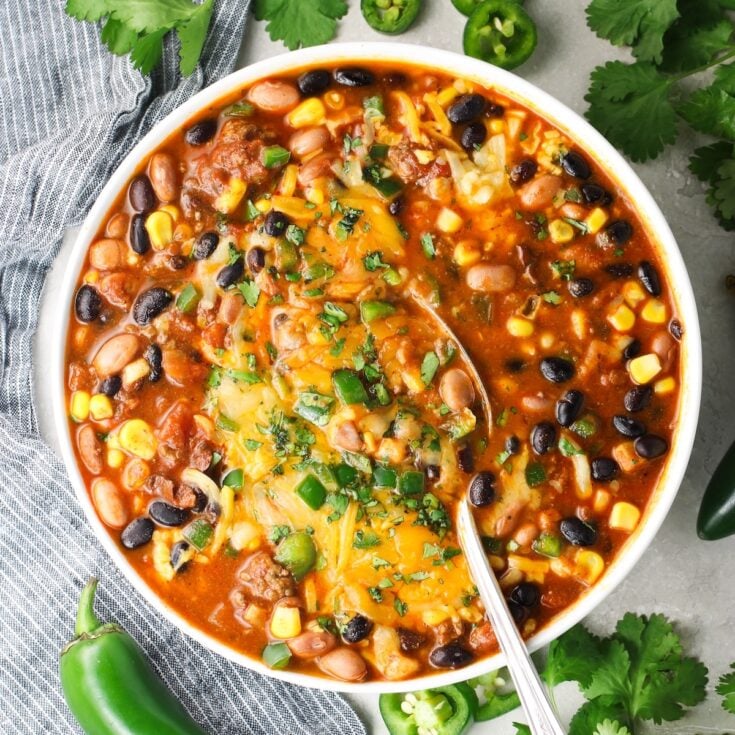 1200x1200 photo of Taco Soup in a bowl with toppings.