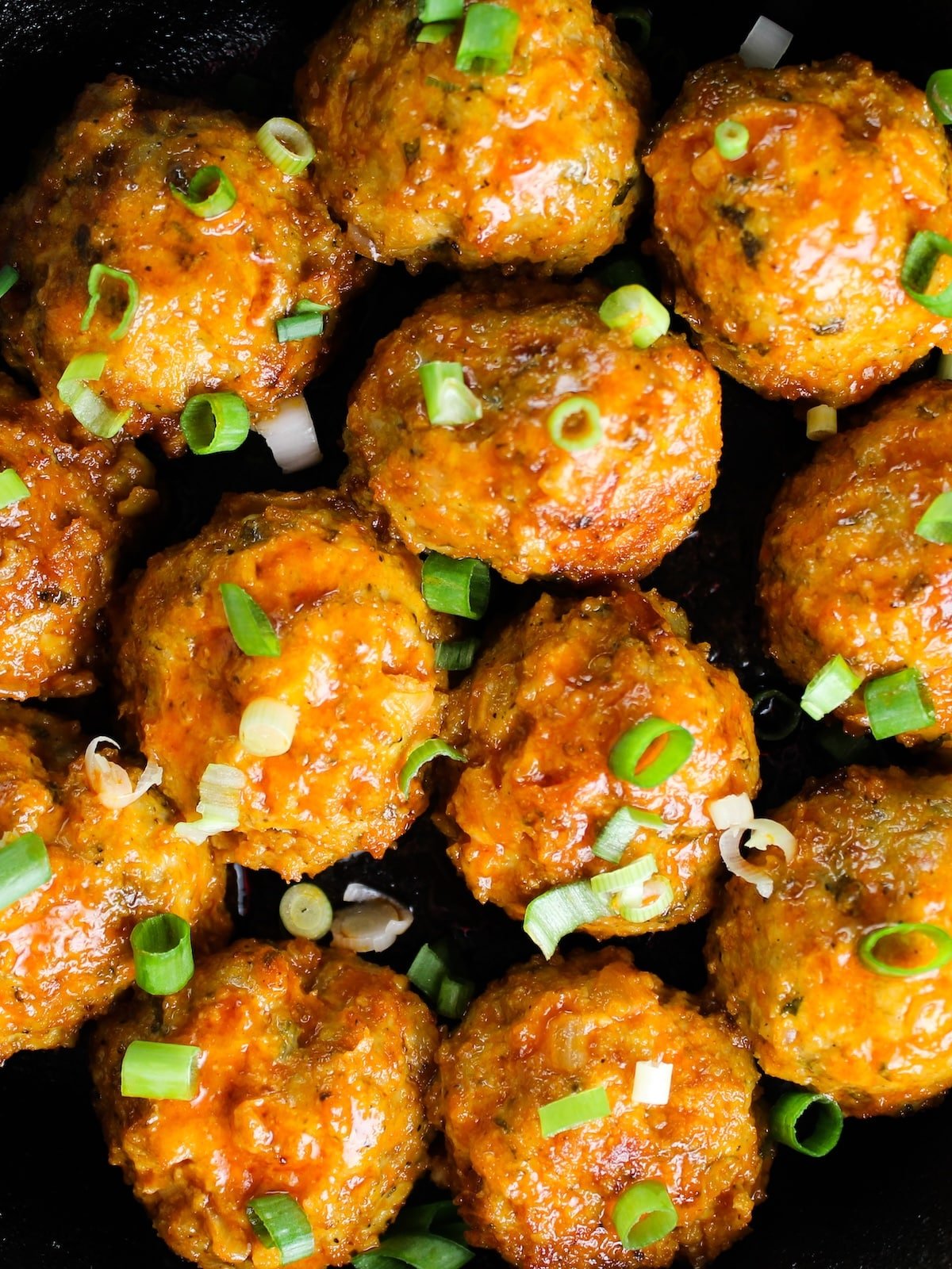 Baked meatballs tossed in hot sauce.