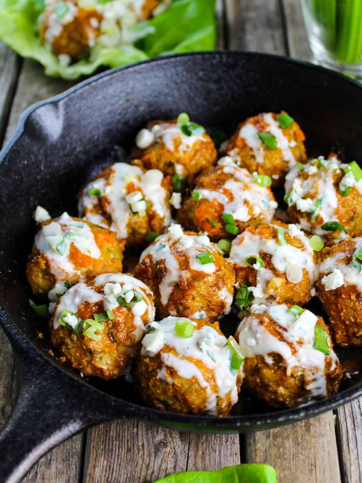 Chicken meatballs tossed in buffalo sauce and drizzle in blue cheese sauce.