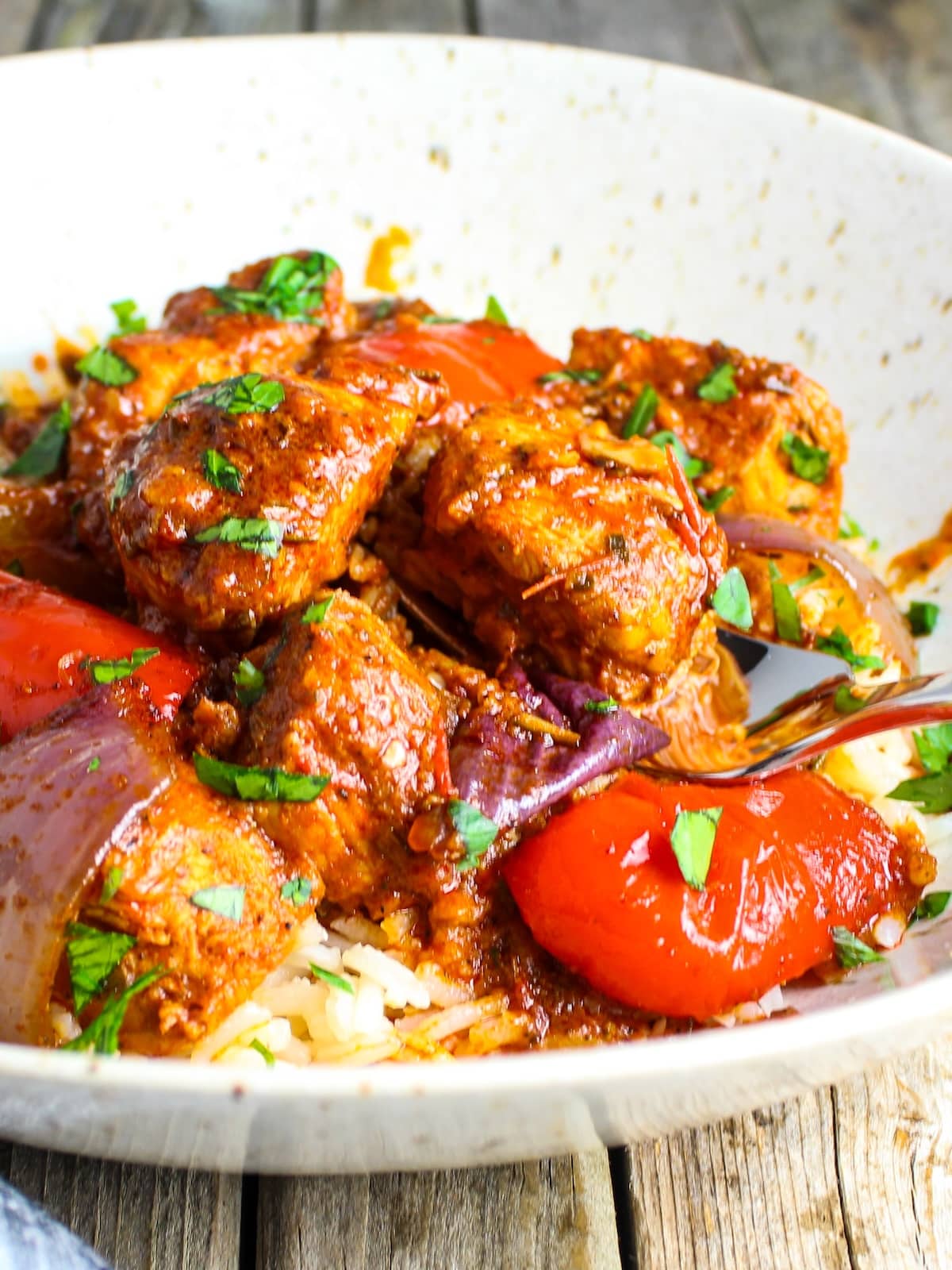 Lemon Harissa Chicken Harissa chicken recipe and veggies cooked and served on a plate.