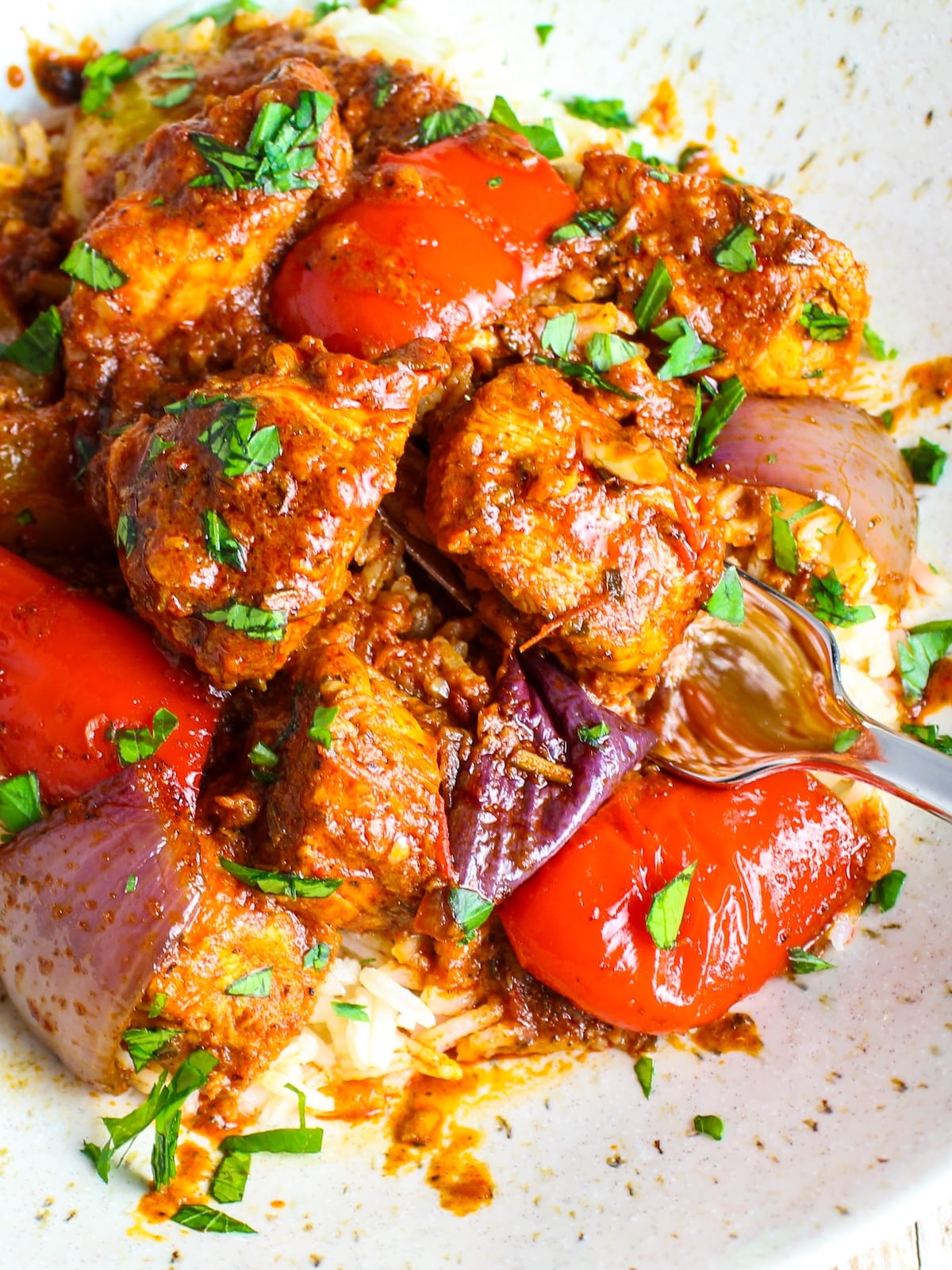 Lemon Harissa Chicken Lemon harissa chicken recipe and veggies cooked and served on a plate.