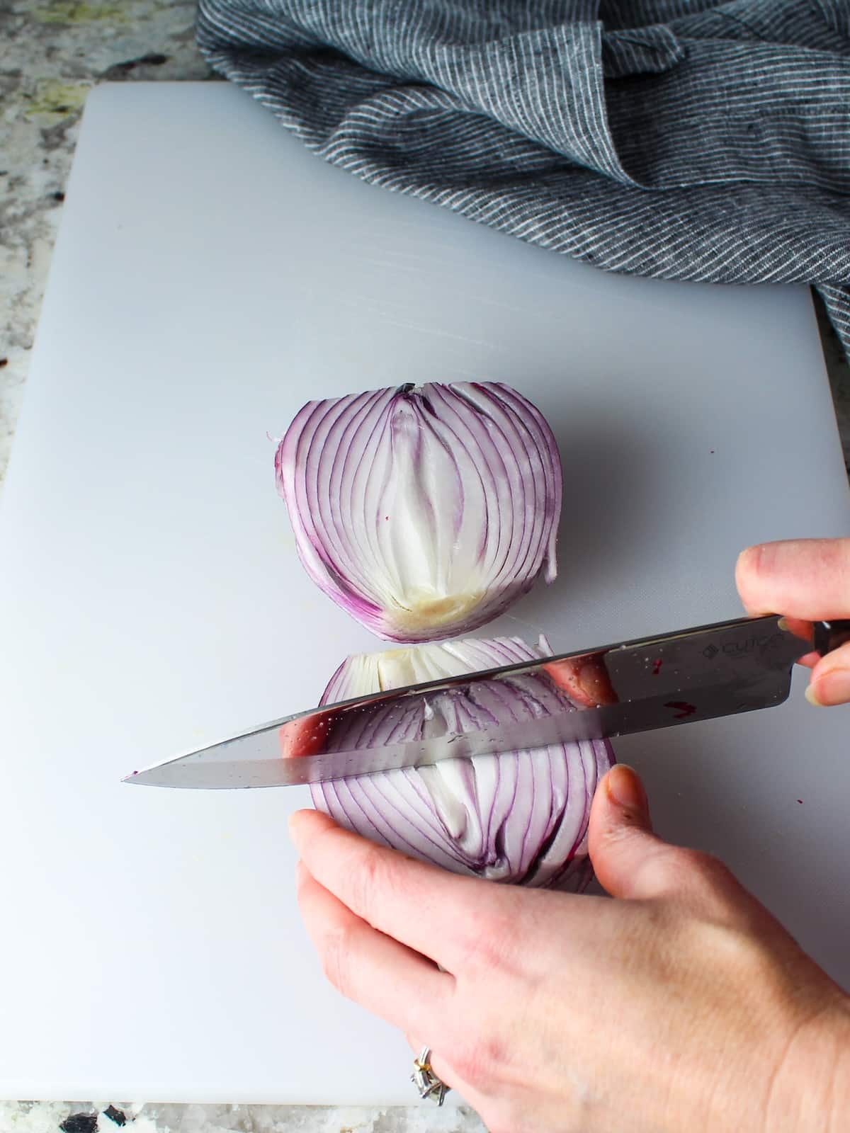 Cutting up a red onion.