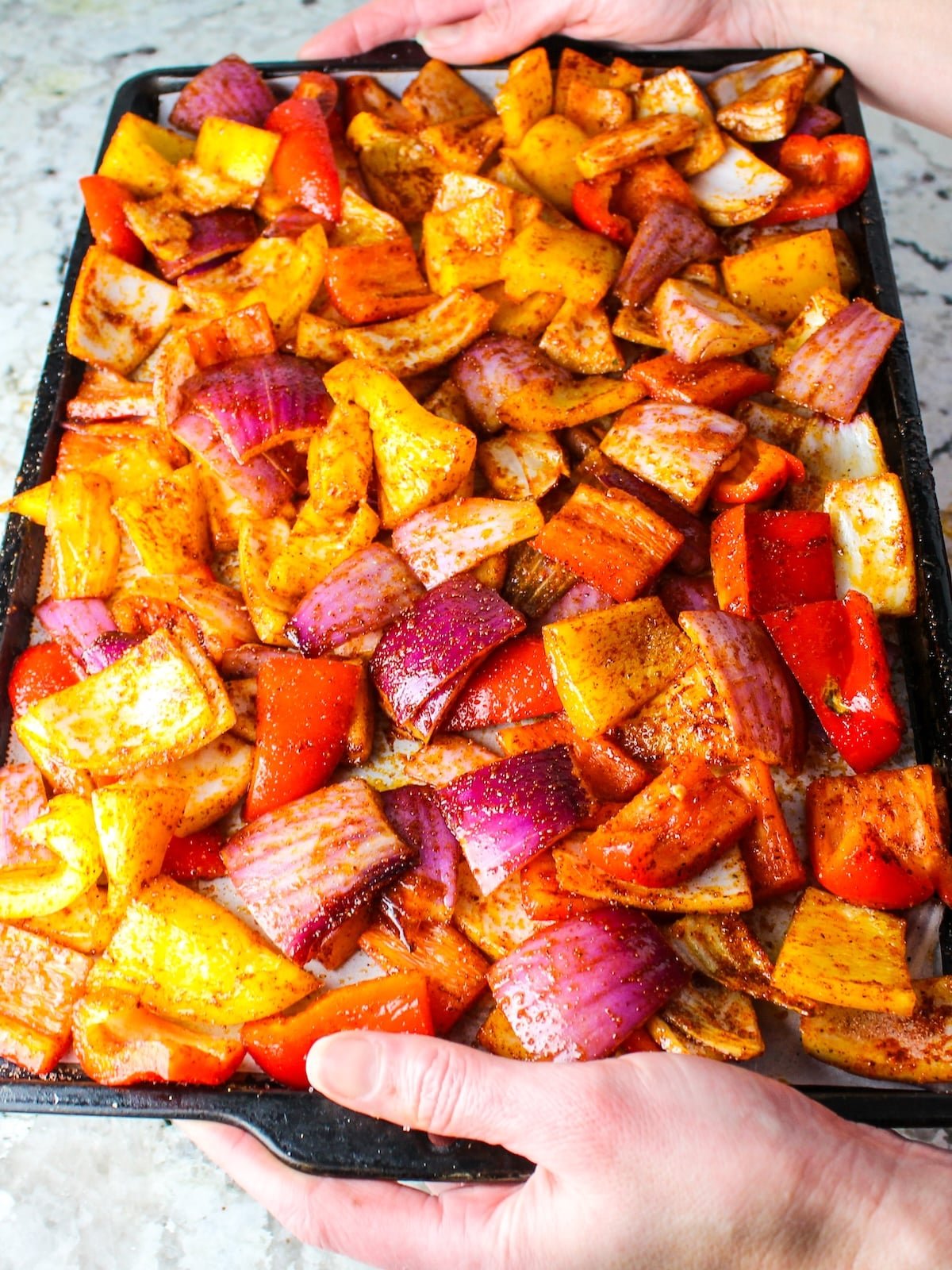 Cut up veggies on a baking sheet with olice oil and seasonings.