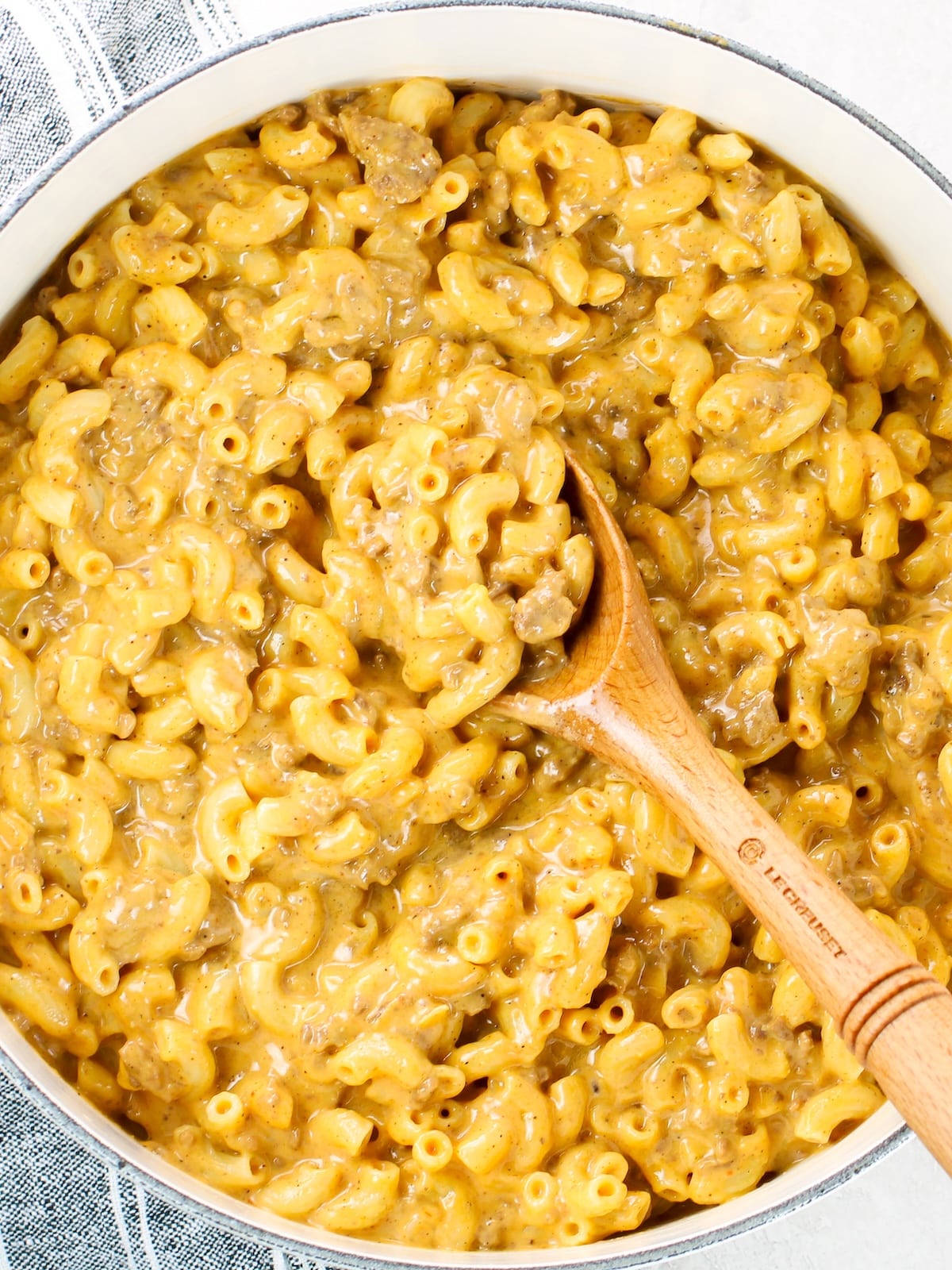 Hamburger mac and cheese cooked in a large pot.
