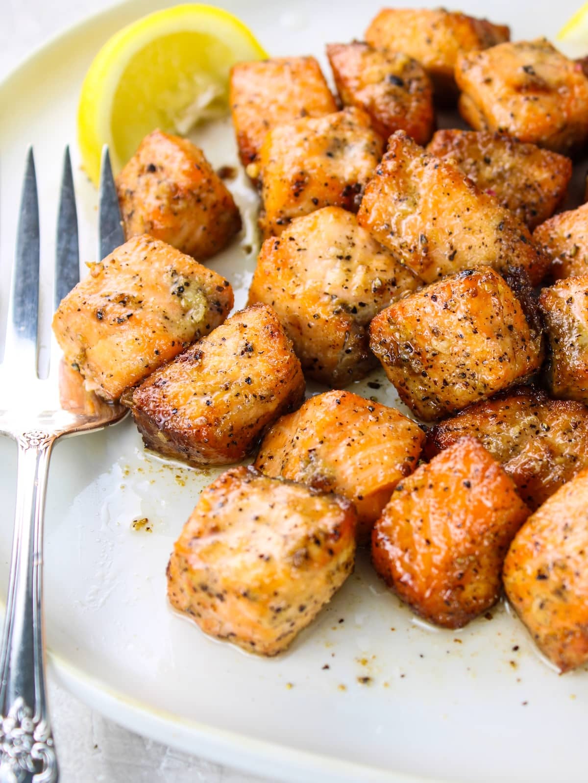 A close up photo of air fried salmon bites.