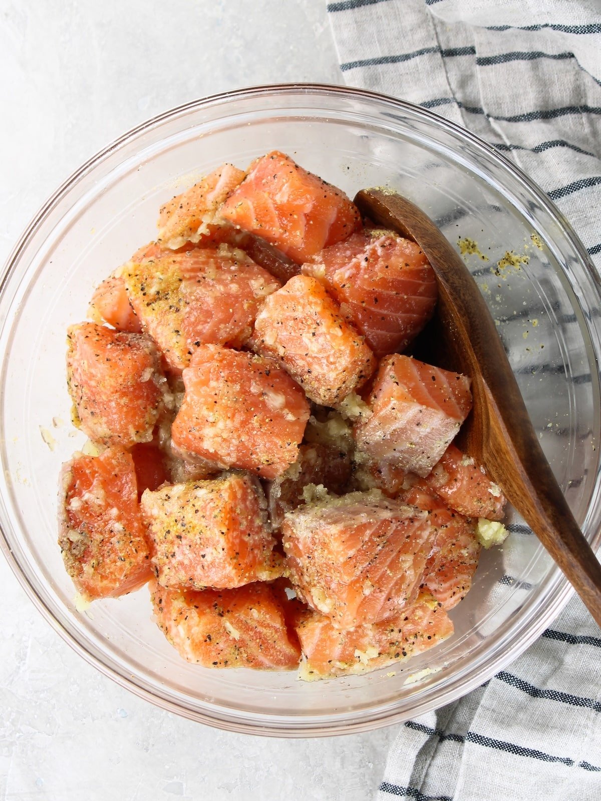 Air Fryer Salmon - cut up salmon tossed with seasonsings, olive oil and minced garlic.