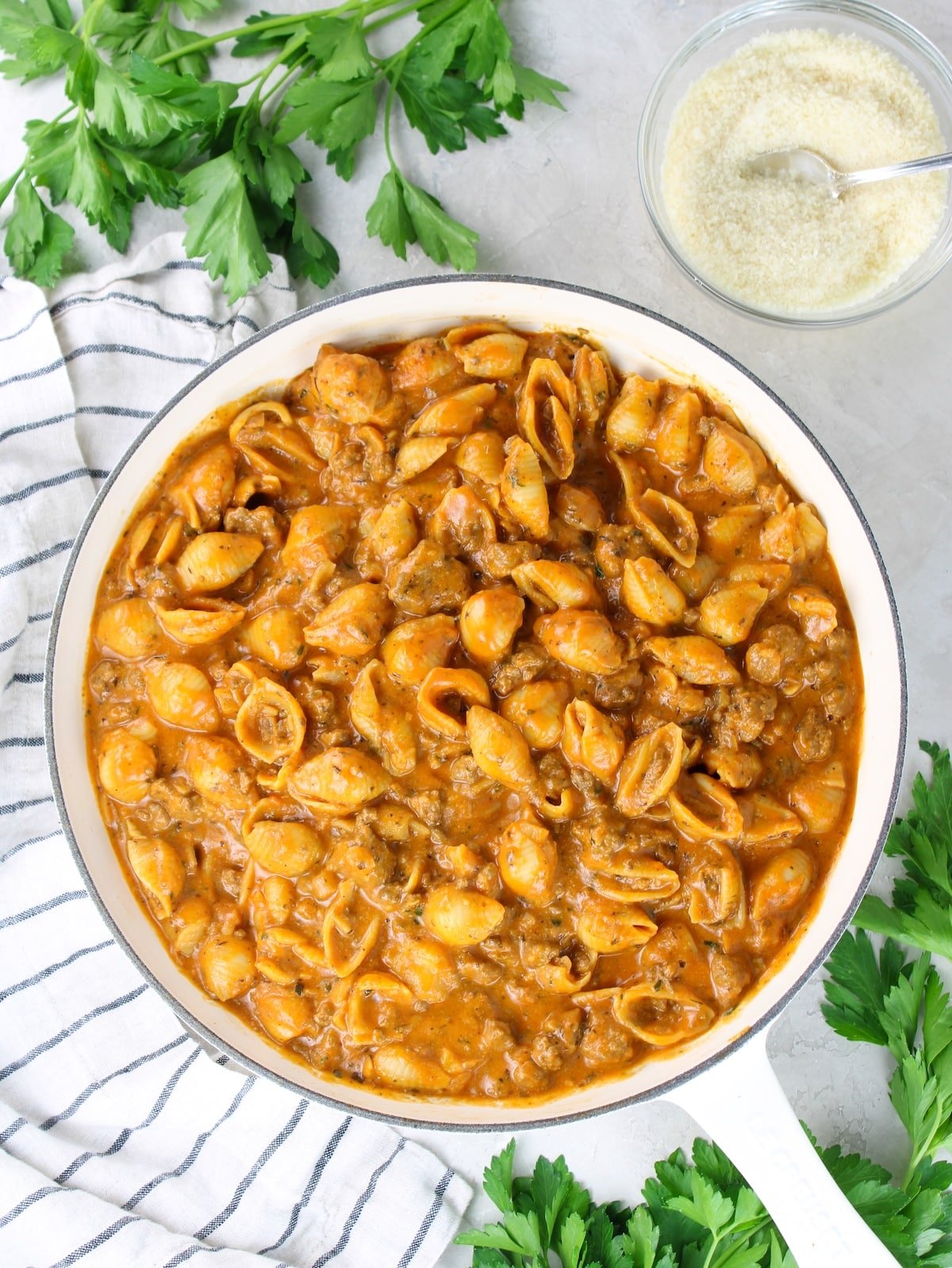 Beef and pasta dinner in a skillet with a rich creamy tomato sauce.