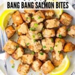 A Pinterest pin of Air Fryer Bang Bang Salon Bites on a plate with lemon wedges.