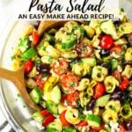 A large bowl of Greek tortellini pasta salad.