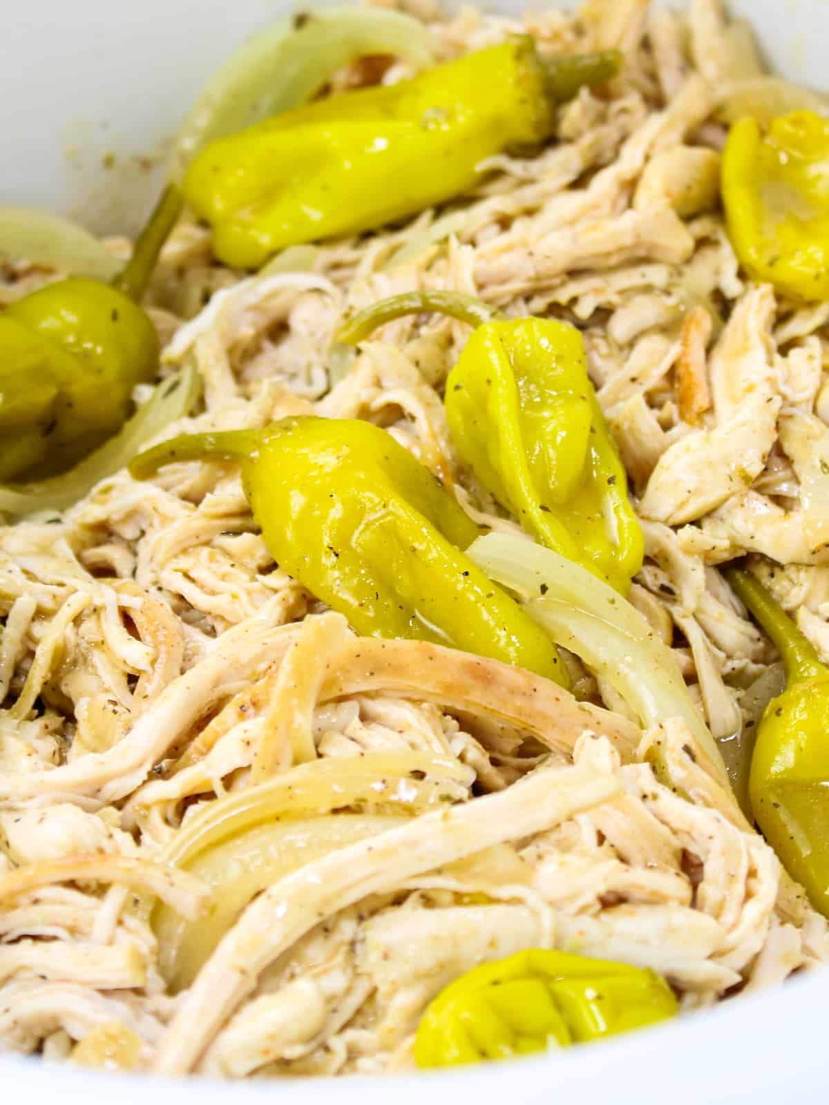 Slow cooked shredded chicken breasts tossed in the sauce with onions and pepperincini peppers.
