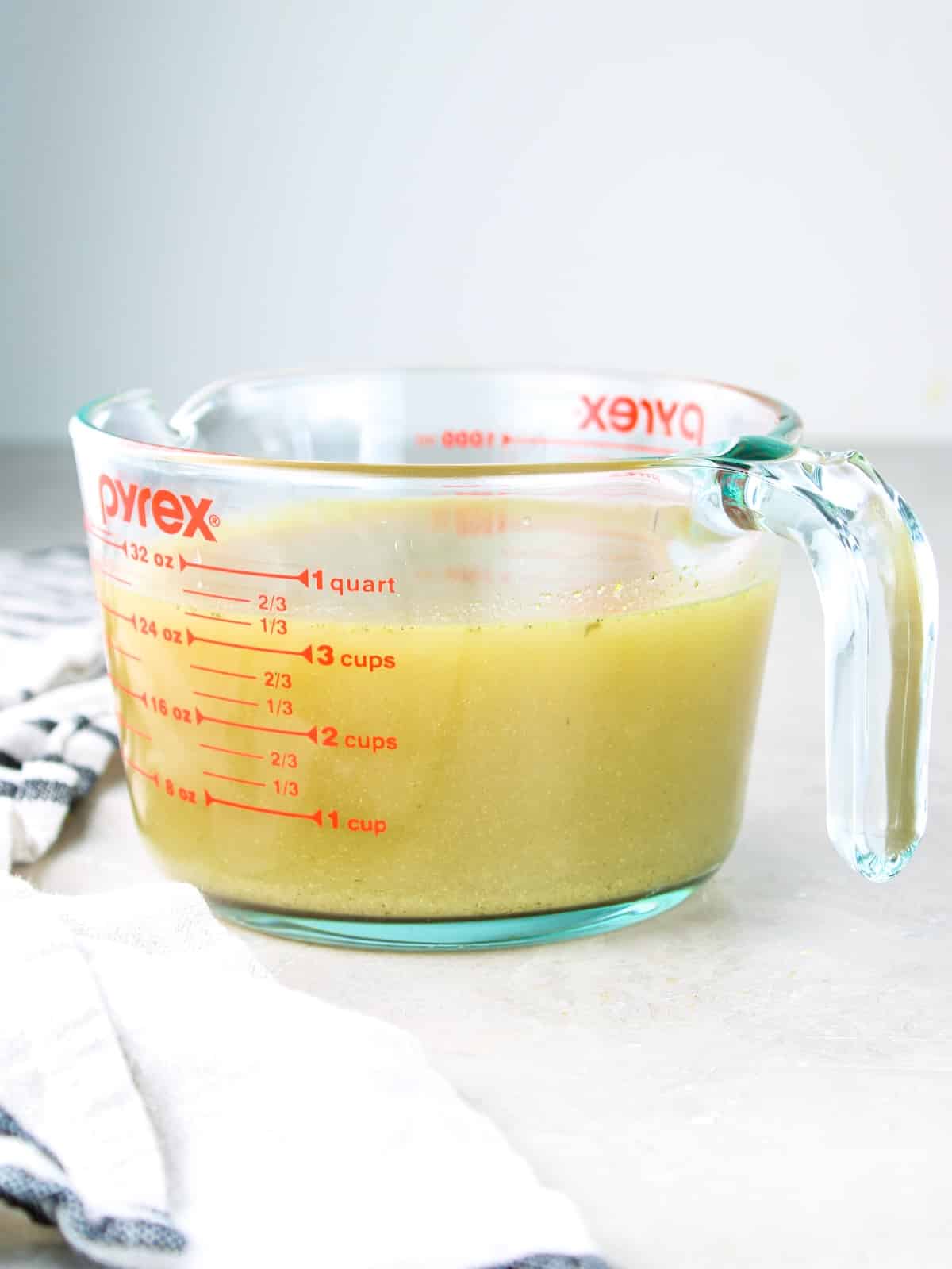 The cooking juices from the Mississippi chicken cooking in the slow cooker.