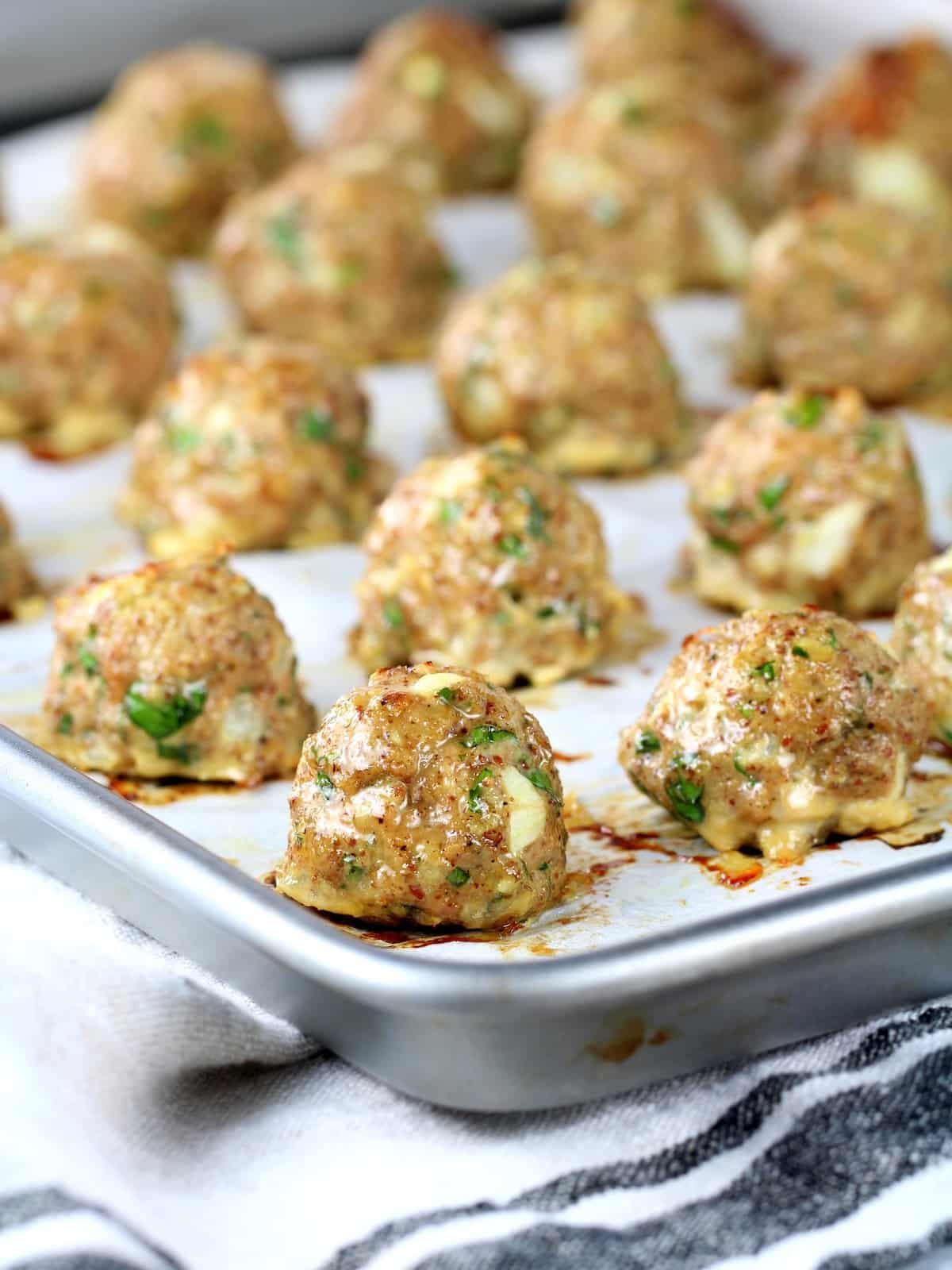 Turkey meatballs oven baked on a baking sheet.