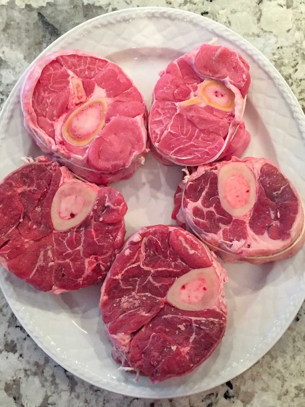 Veal for Osso Buco tied on a platter.