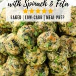 Overhead view of baked Greek chicken meatballs with spinach, feta, and fresh parsley on a white plate — easy low-carb meal prep recipe.