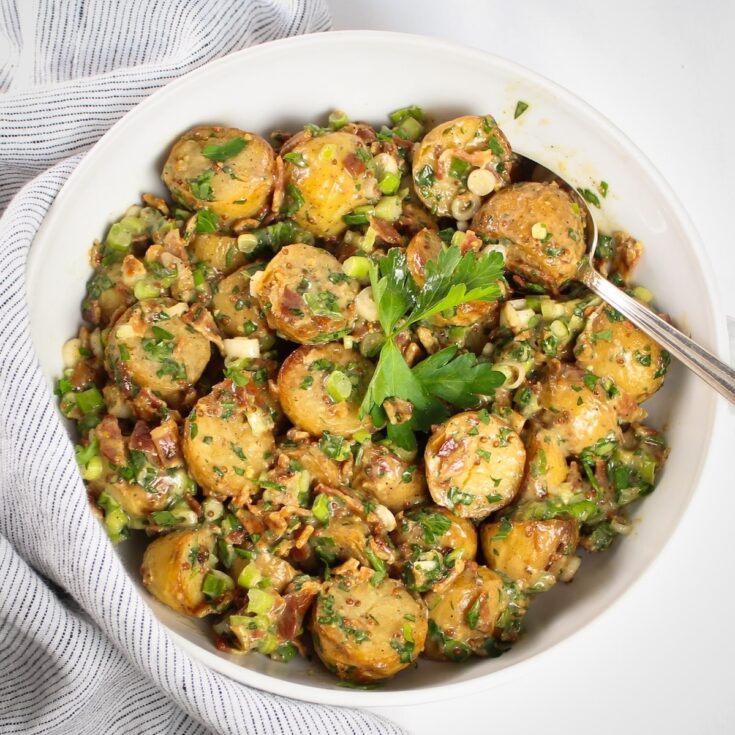 Salt and Vinegar Potato Salad with bacon, green onions, parsley, and tangy vinegar dressing